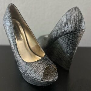 Black and silver Steve Madden wedges. Size 8.